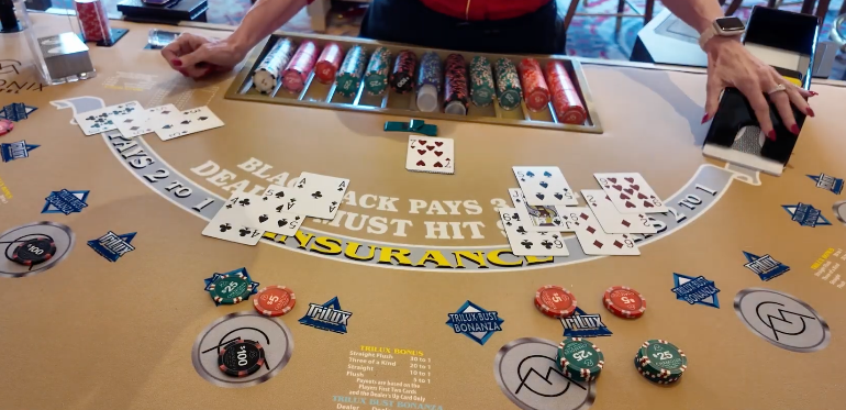 Blackjack cards and chips at a casino table